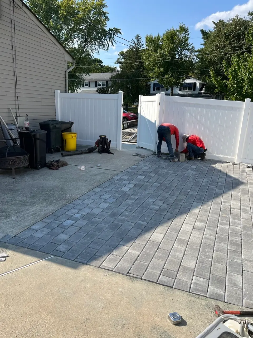 P&F Lawn Care crew installing a paver patio
